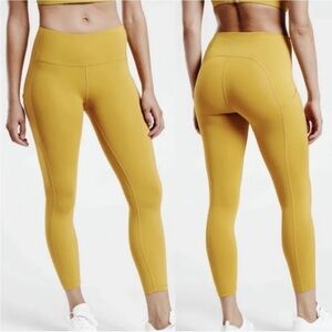 NWT Athleta ultimate stash 7/8 pocket leggings mustard yellow gold xs